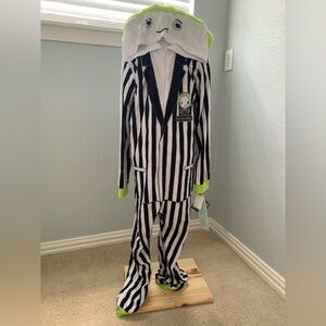 Black and White Striped Costume with Green Accents